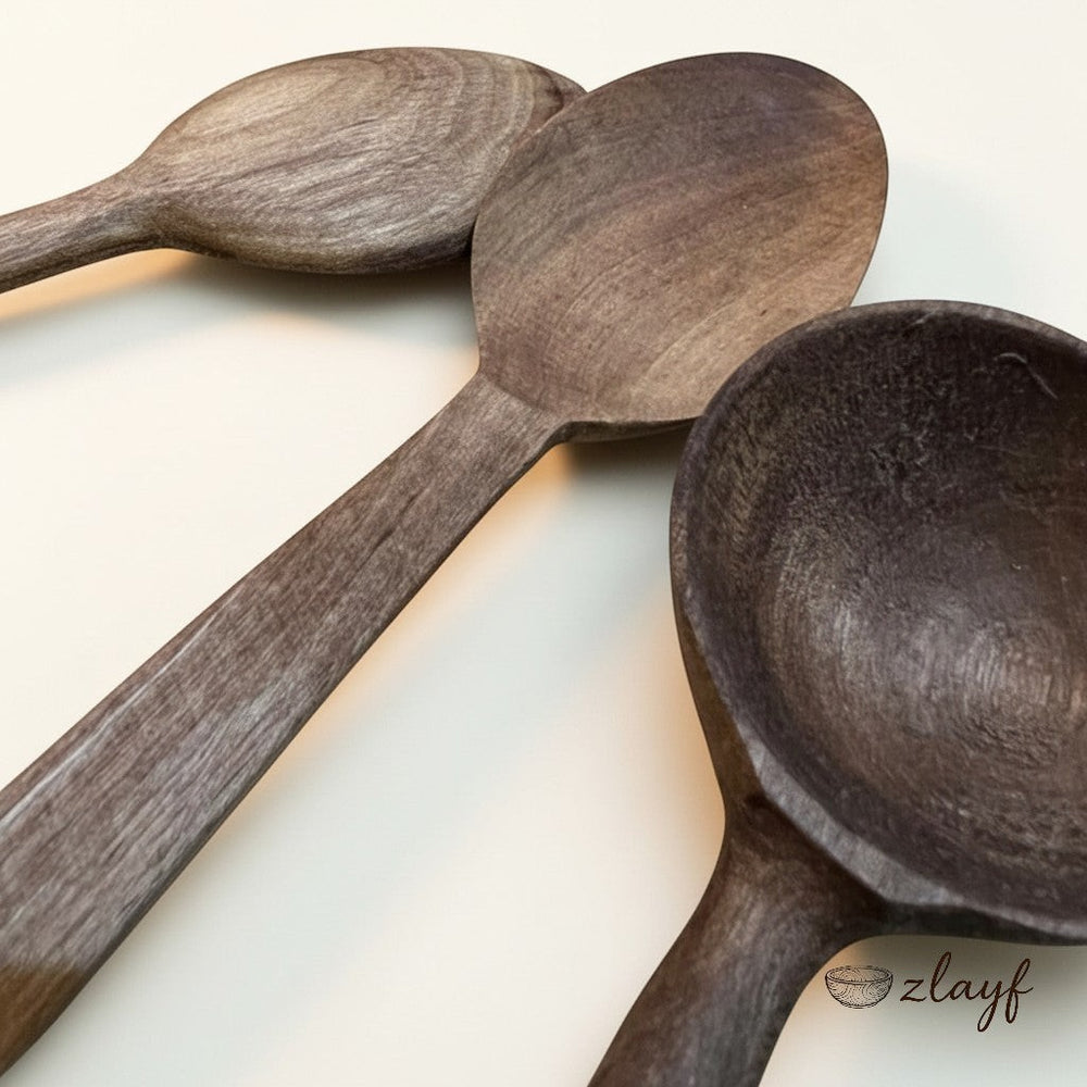 Zlayf set of three rustic wooden spoons in natural wood, with warm earthy tones and unique grain. Perfect for cooking and serving.