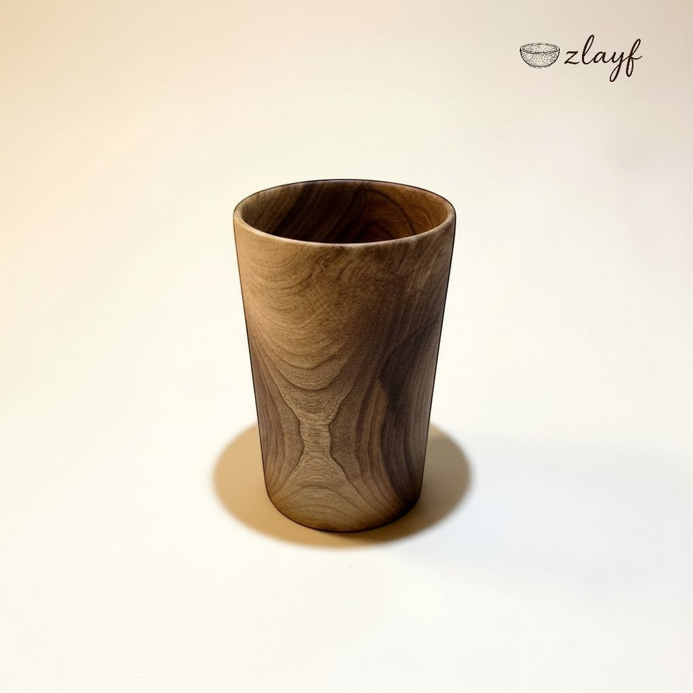 Zlayf dark wood tumbler with unique grain patterns and tapered design. Perfect for coffee or spirits.