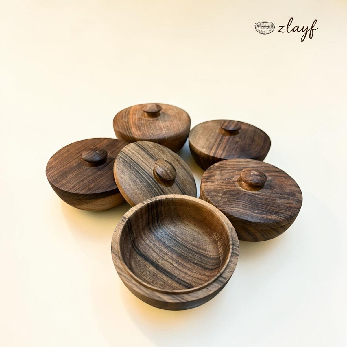 Zlayf handcrafted dark wood storage containers with lids, featuring unique grain patterns and knob details. Perfect for home decor or kitchen organization.